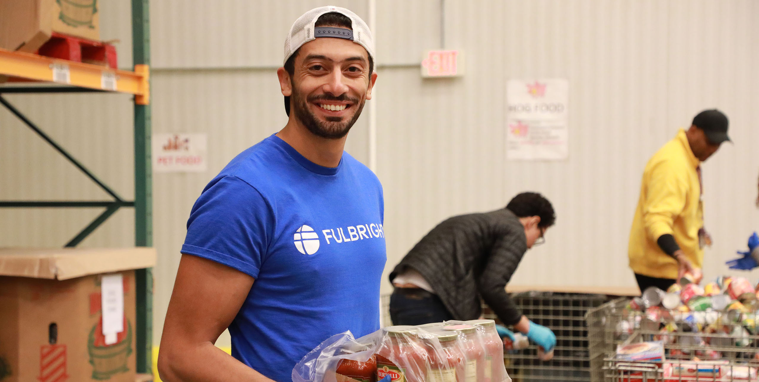 Photo of a Fulbrighter helping at a food bank.