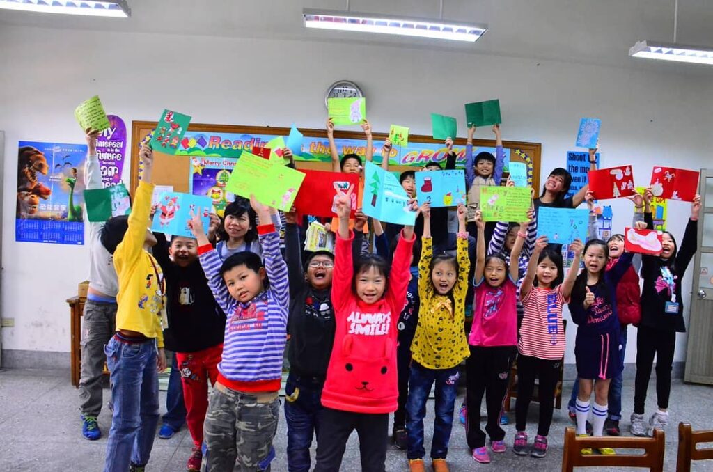 Elementary school students holding up hand-made posters, via Instagram.
