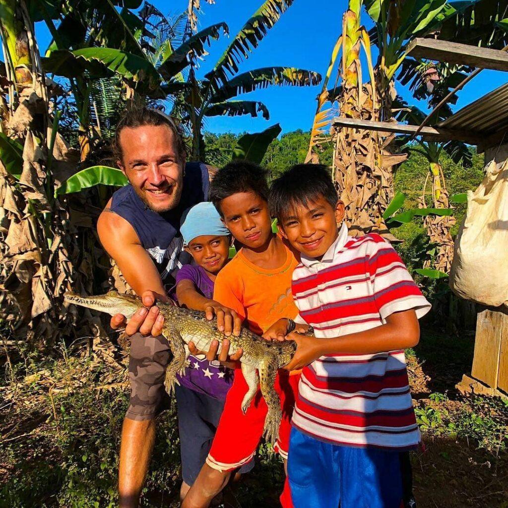 Joey Brown with children in the Philippines
