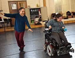 Alito Alessi dancing with a person in a wheelchair